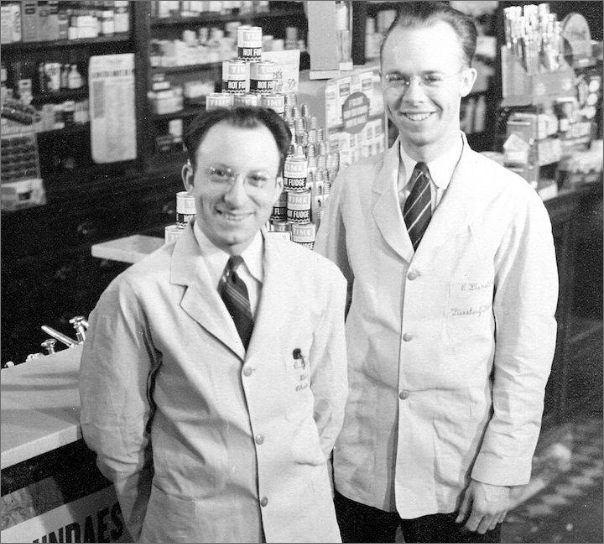 two men standing in building